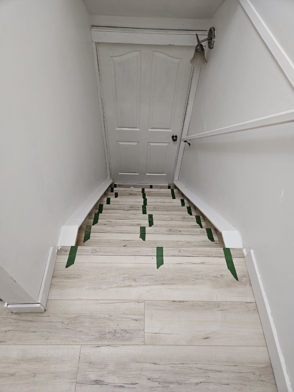 Installing new baseboards on stairway in Calgary home